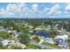 An aerial shot showing a large neighborhood with houses and a lake at 2215 39Th W St, Bradenton, FL 34205