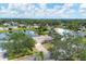 Aerial view of a single-Gathering home with a pool and lake access in a quiet community at 2215 39Th W St, Bradenton, FL 34205