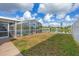 Spacious backyard with pool, screened enclosure and lake view at 2215 39Th W St, Bradenton, FL 34205