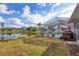 Peaceful backyard setting with pool and lake view at 2215 39Th W St, Bradenton, FL 34205