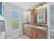 Double vanity bathroom with granite countertop at 2215 39Th W St, Bradenton, FL 34205
