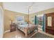 Bedroom with a full-size bed and large windows at 2215 39Th W St, Bradenton, FL 34205