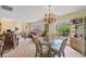 Bright dining area with wicker furniture and a glass-top table at 2215 39Th W St, Bradenton, FL 34205