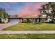 Brick, single-story home with attached garage and well-manicured lawn at 2215 39Th W St, Bradenton, FL 34205