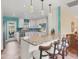 Eat-in kitchen with granite island, stainless steel appliances, and teal details at 2215 39Th W St, Bradenton, FL 34205