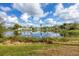 Serene lake view with houses lining the shore at 2215 39Th W St, Bradenton, FL 34205