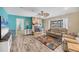 Living room with stone fireplace and an accent wall at 2215 39Th W St, Bradenton, FL 34205