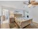 Main bedroom with large bed, ensuite bathroom access, and wood floors at 2215 39Th W St, Bradenton, FL 34205