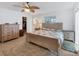 Main bedroom with wood-look floors and ceiling fan at 2215 39Th W St, Bradenton, FL 34205