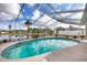 Inviting kidney-shaped pool with screened enclosure at 2215 39Th W St, Bradenton, FL 34205