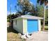 Detached garage with a blue door at 2253 Arlington St, Sarasota, FL 34239