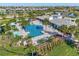 Aerial view of the community pool, clubhouse, and surrounding homes at 3405 Box Turtle Ter, Parrish, FL 34219