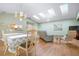 Dining area with a table, chandelier, and view of the living room and kitchen at 3424 Brookridge Ln, Parrish, FL 34219