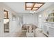 Formal dining room with a wooden table and white hutch at 3970 Prairie Dunes Dr, Sarasota, FL 34238