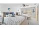 Bright guest bedroom with two twin beds and beachy decor at 3970 Prairie Dunes Dr, Sarasota, FL 34238