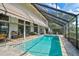 Inviting pool area with covered patio and screened enclosure at 3970 Prairie Dunes Dr, Sarasota, FL 34238