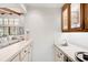 Convenient wet bar with sink and cabinetry at 3970 Prairie Dunes Dr, Sarasota, FL 34238