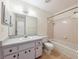 Bathroom with bathtub/shower combo, vanity, and tile flooring at 4064 Velarde Ln, Sarasota, FL 34235