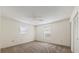 Spacious bedroom with carpeted flooring, ceiling fan, and ample natural light at 4064 Velarde Ln, Sarasota, FL 34235