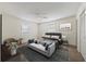 Bedroom featuring a king-size bed, ceiling fan, and plush carpeting at 4064 Velarde Ln, Sarasota, FL 34235