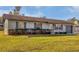 Inviting single-story home with a lush green lawn and neat landscaping at 4064 Velarde Ln, Sarasota, FL 34235