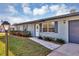 Charming single-story home with a welcoming front yard and walkway at 4064 Velarde Ln, Sarasota, FL 34235