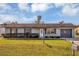 Charming single-story home with a well-manicured lawn and landscaping at 4064 Velarde Ln, Sarasota, FL 34235