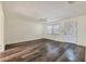 Welcoming living room with wood-look floors, ceiling fan, and natural light at 4064 Velarde Ln, Sarasota, FL 34235