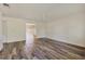 Bright and open living room with wood-look flooring and a ceiling fan at 4064 Velarde Ln, Sarasota, FL 34235