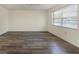 Spacious living room with ample natural light from large windows at 4064 Velarde Ln, Sarasota, FL 34235