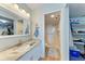Bathroom with vanity, granite countertop, and walk-in shower at 4550 Pinebrook Cir # 304, Bradenton, FL 34209