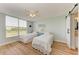 Bright bedroom with two twin beds, large window, and wood-look flooring at 4550 Pinebrook Cir # 304, Bradenton, FL 34209