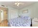 Bedroom with double doors to closet and ceiling fan at 4550 Pinebrook Cir # 304, Bradenton, FL 34209