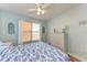 Bedroom with ceiling fan, dresser, and window at 4550 Pinebrook Cir # 304, Bradenton, FL 34209