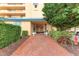 Attractive building exterior with well-maintained landscaping and inviting entrance at 4550 Pinebrook Cir # 304, Bradenton, FL 34209