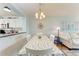 Dining area with table and chairs, adjacent to the kitchen at 4550 Pinebrook Cir # 304, Bradenton, FL 34209