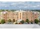 Condo building exterior, showcasing ample parking at 4550 Pinebrook Cir # 304, Bradenton, FL 34209