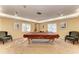 Community game room features a pool table and comfortable seating at 4550 Pinebrook Cir # 304, Bradenton, FL 34209