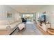 Bright living room with view to balcony and access to the outdoors at 4550 Pinebrook Cir # 304, Bradenton, FL 34209