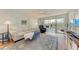 Spacious living room with comfy furniture and access to a balcony at 4550 Pinebrook Cir # 304, Bradenton, FL 34209