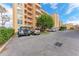 Parking area with cars parked in front of condo building at 4550 Pinebrook Cir # 304, Bradenton, FL 34209