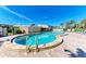 Inviting kidney-shaped swimming pool with surrounding patio at 4550 Pinebrook Cir # 304, Bradenton, FL 34209