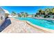 Refreshing swimming pool with plenty of lounge chairs at 4550 Pinebrook Cir # 304, Bradenton, FL 34209