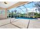 Inviting screened pool and patio area with backyard view at 4669 Sweetmeadow Cir, Sarasota, FL 34238