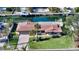 Property showcasing canal front, lush lawn, and dock at 537 Halyard Ln, Longboat Key, FL 34228