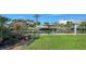 Landscaped backyard with canal access and private dock at 537 Halyard Ln, Longboat Key, FL 34228