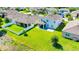 Aerial view of home with screened porch, fenced yard, and neighboring houses at 5714 Broad River Run, Ellenton, FL 34222