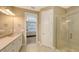 Inviting Primary bathroom with dual sinks, glass shower, and private entry at 5737 Semolino St, Nokomis, FL 34275