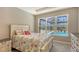 Bright bedroom with pool view and stylish furnishings at 5737 Semolino St, Nokomis, FL 34275