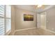 Spacious bedroom with neutral walls, white trim, and plantation shutters at 5737 Semolino St, Nokomis, FL 34275